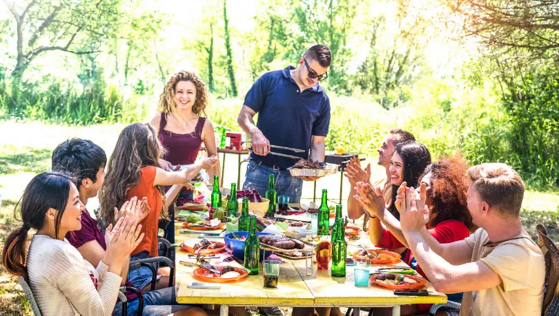 happy-friends-having-fun-together-at-barbecue-picn-2024-07-03-02-44-04-utc